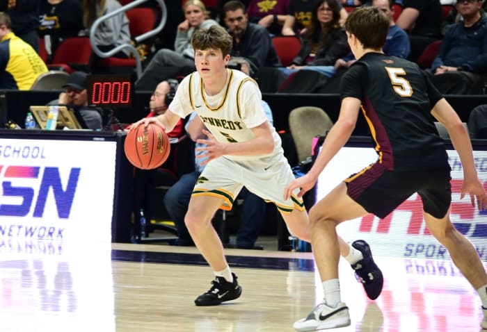 Cedar Rapids Kennedy's Griffin Gerdes drives against Ankeny's Cash Schoolen during a Class 4A state tournament semifinal at Wells Fargo Arena in Des Moines on Thursday. (Photo by Ryan Timmerman)